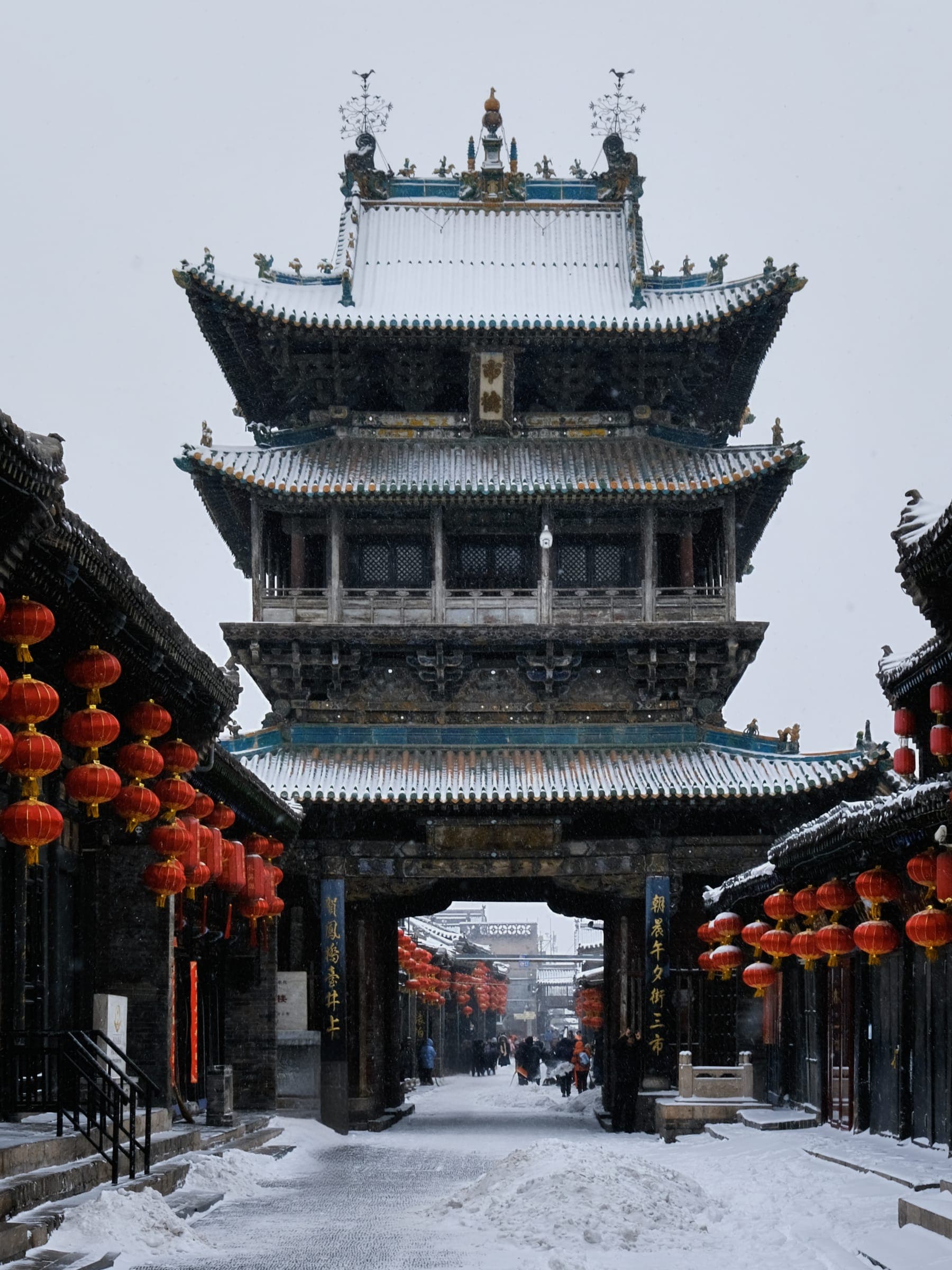 Snow-covered Pingyao City Tower and gateway
